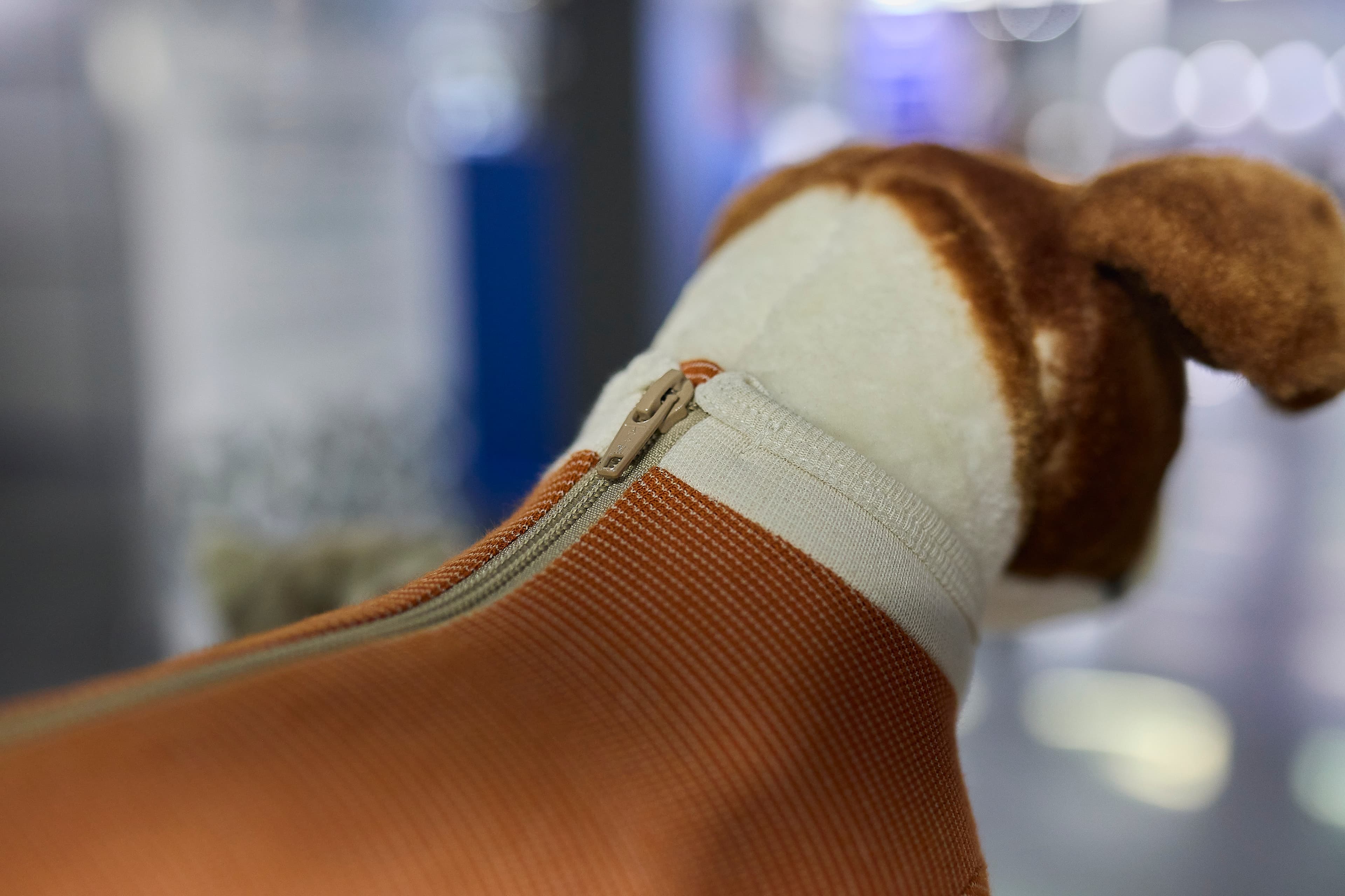 Close-up of the CopperBody suit zipper and fabric detail